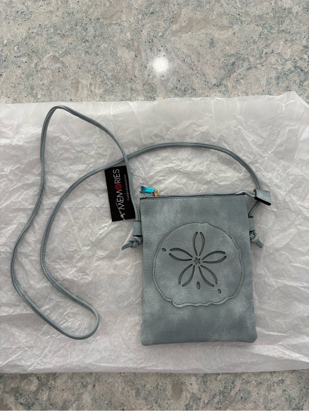 Sand Dollar Cross Body Bag with cell phone pocket and adjustable straps. NWT